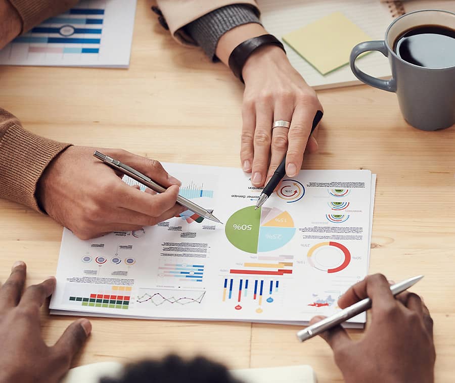 People Discussing Charts and Graphs due diligence immobiliare